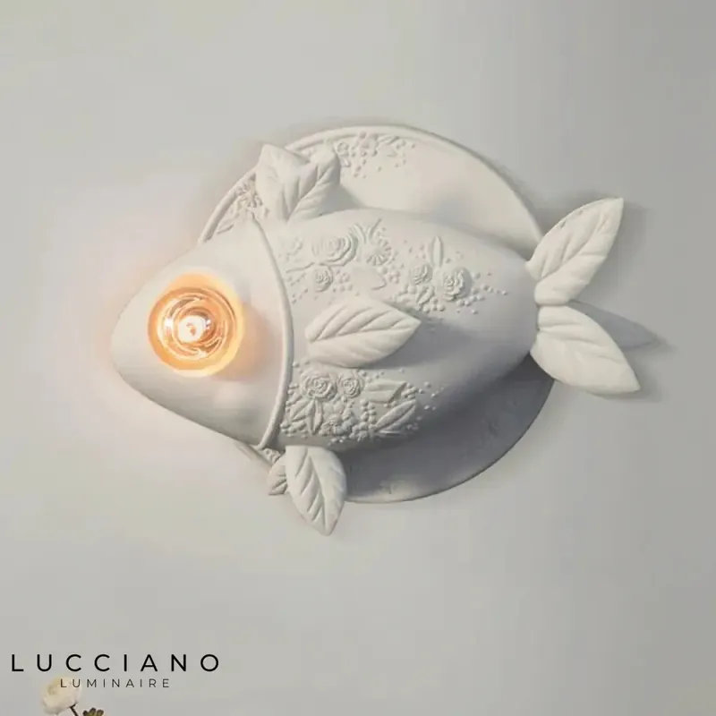 Trendy glowing fish wall light.