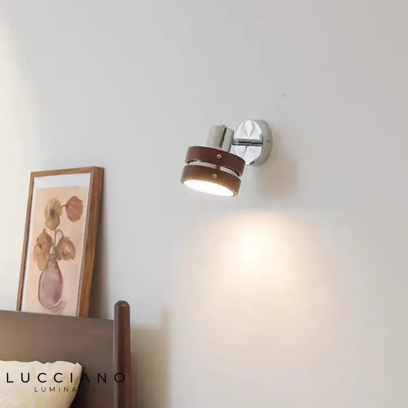 Small designer LED wall light for a cozy reading ambiance