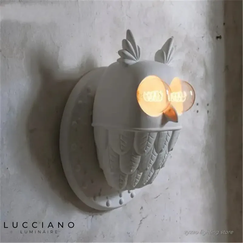 Stylized owl wall lamp, trendy decor.
