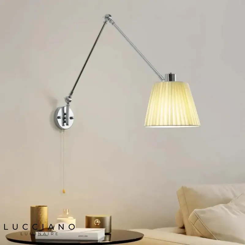 Designer adjustable articulated telescopic wall light.