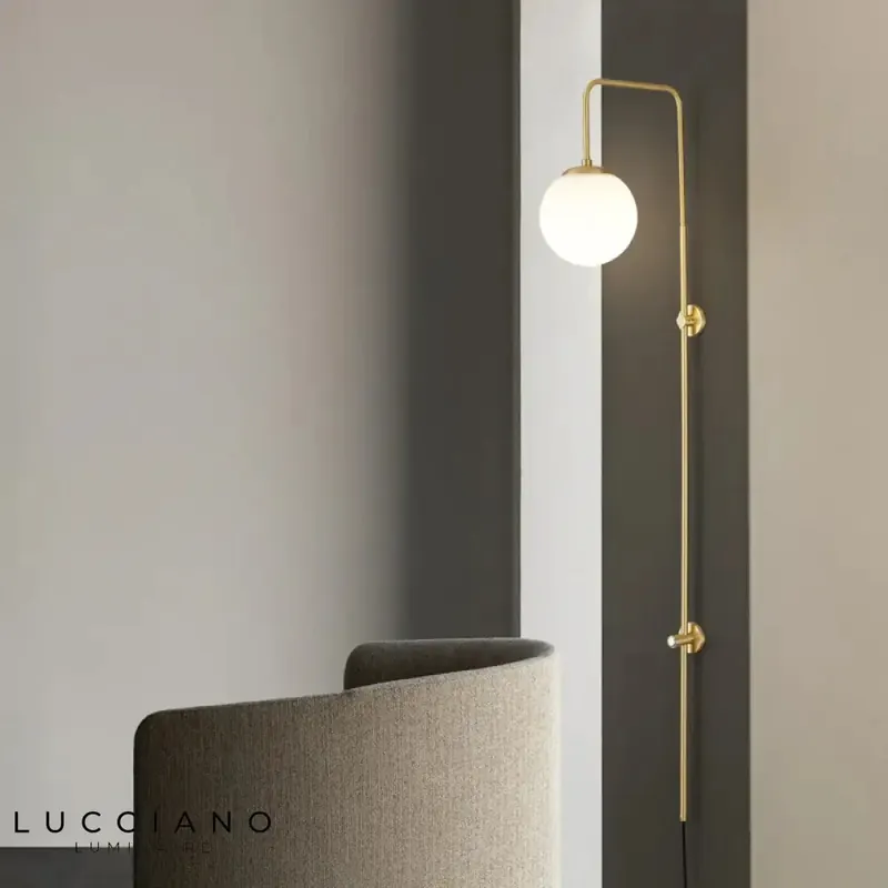 Chic contemporary design brass wall light.