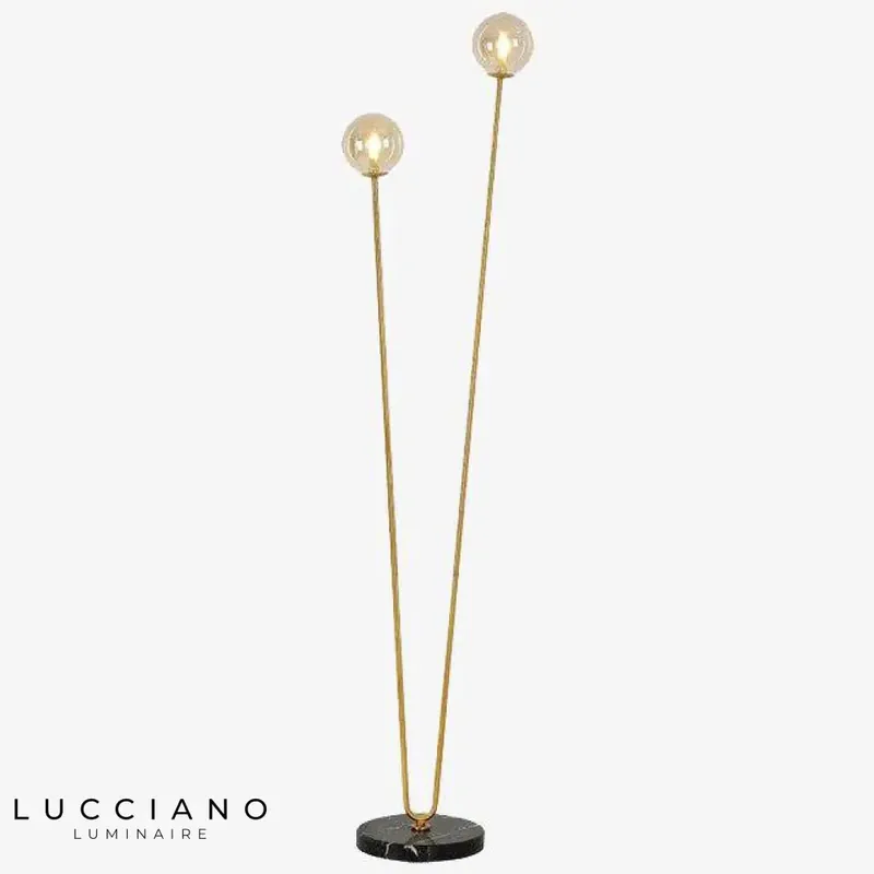 Gold floor lamp with two glass arms