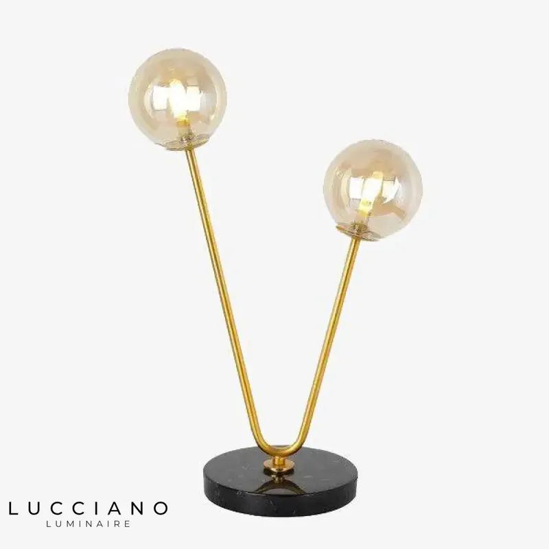 Two-arm gold bedside lamp