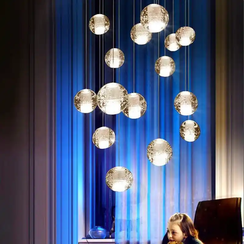 Modern crystal chandelier with rotating LED sphere pendant
