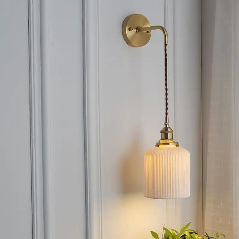 Japanese brass and pleated glass wall lamp, one light