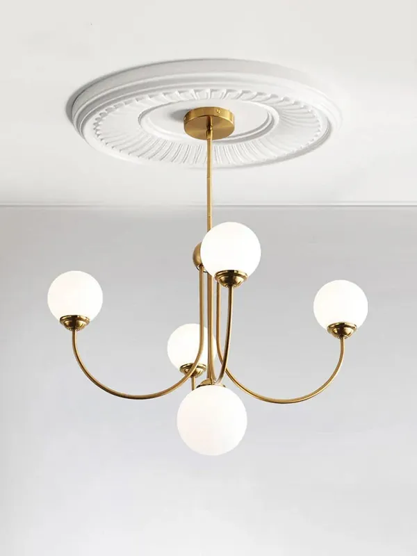 Retro chandelier illuminates contemporary decor.